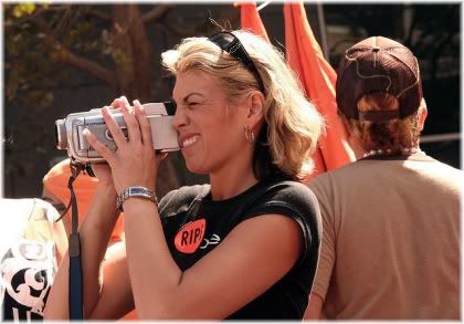 Woman holding camcorder.