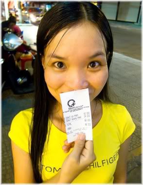 girl holding receipt