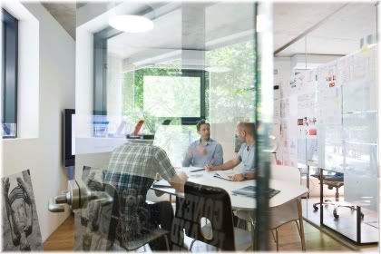 people in glass office