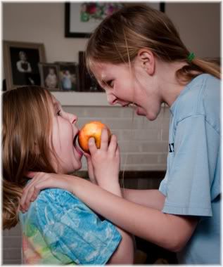 sisters fighting over apple
