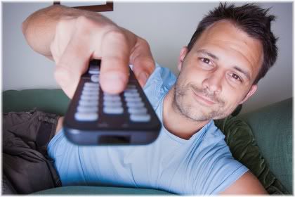 man with tv remote