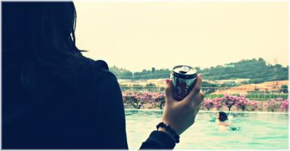 woman holding coke can