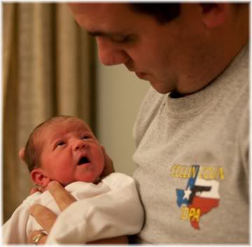 father holding baby