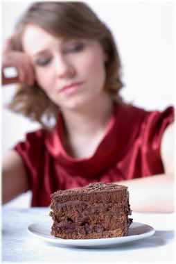 woman staring at cake