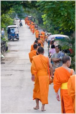 monks walking down road