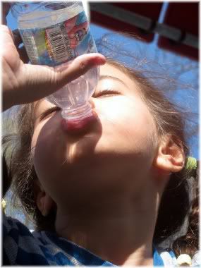 girl drinking bottle of water