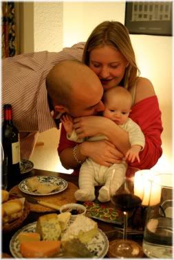 parents with baby at meal table