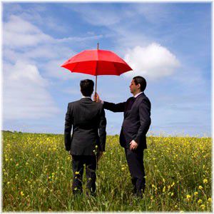 man holding umbrella over another man