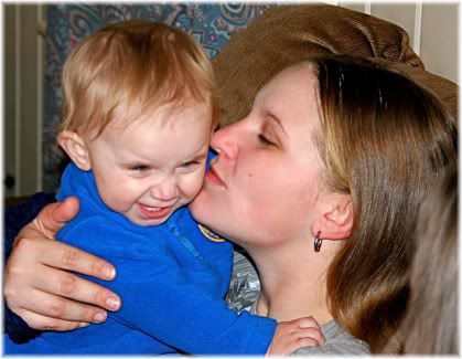 mother kissing child