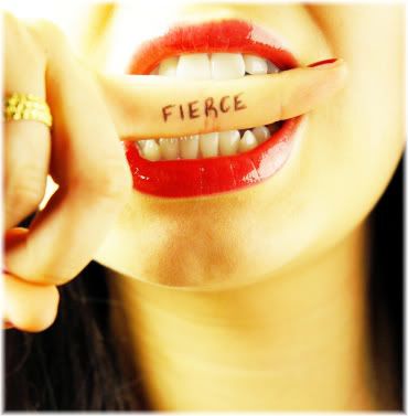 woman biting finger with fierce written on it.