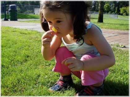 girl smelling flower