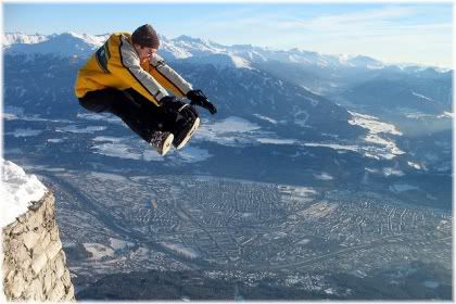 man jumping off cliff