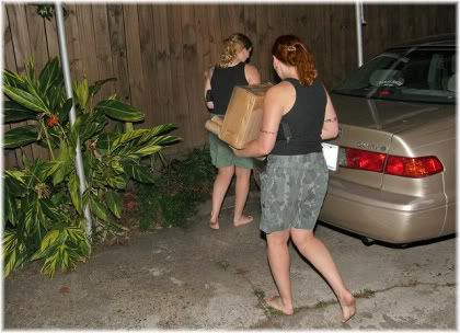 women carrying boxes