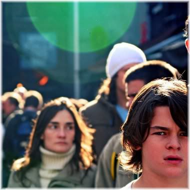 boy walking in crowded street